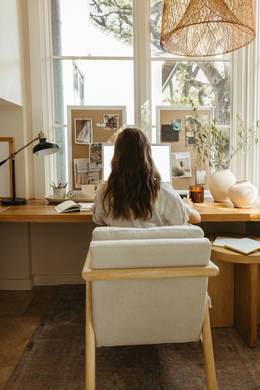 woman-writing-at-desk-865x1296.jpg