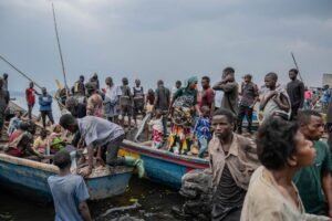 people-fleeing-m-23-rebel-97136126.jpg