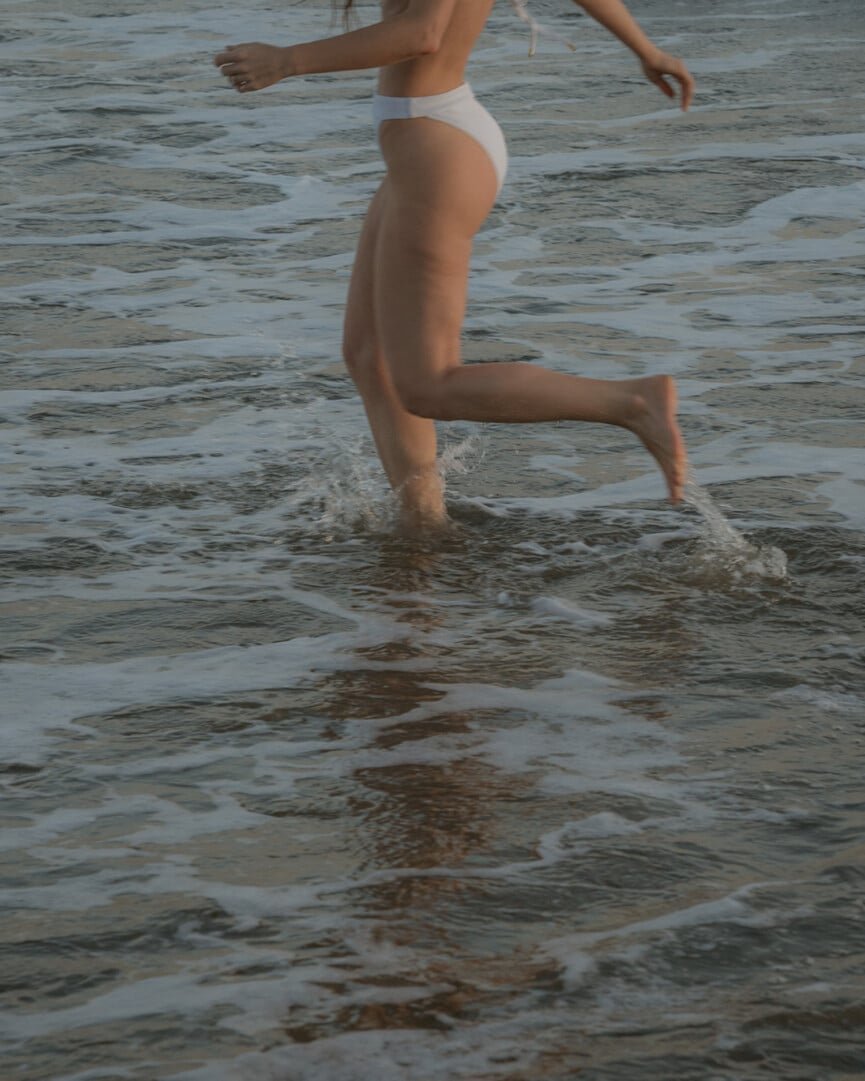 woman-running-in-water-865x1081.jpg
