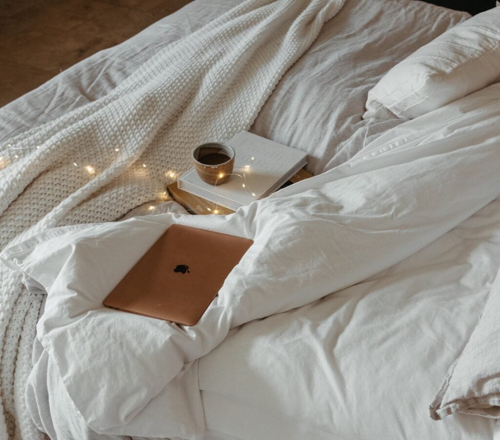 laptop-cozy-bed-best-fall-movies-e1724601317475.jpg