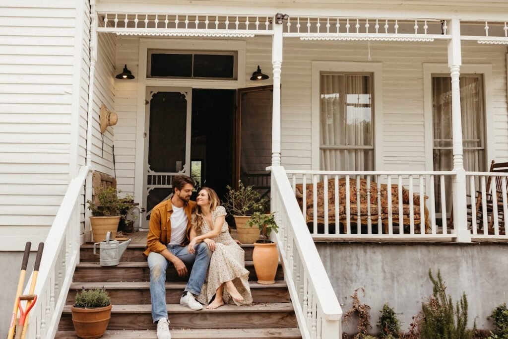 couple-smiling-front-porch.jpg