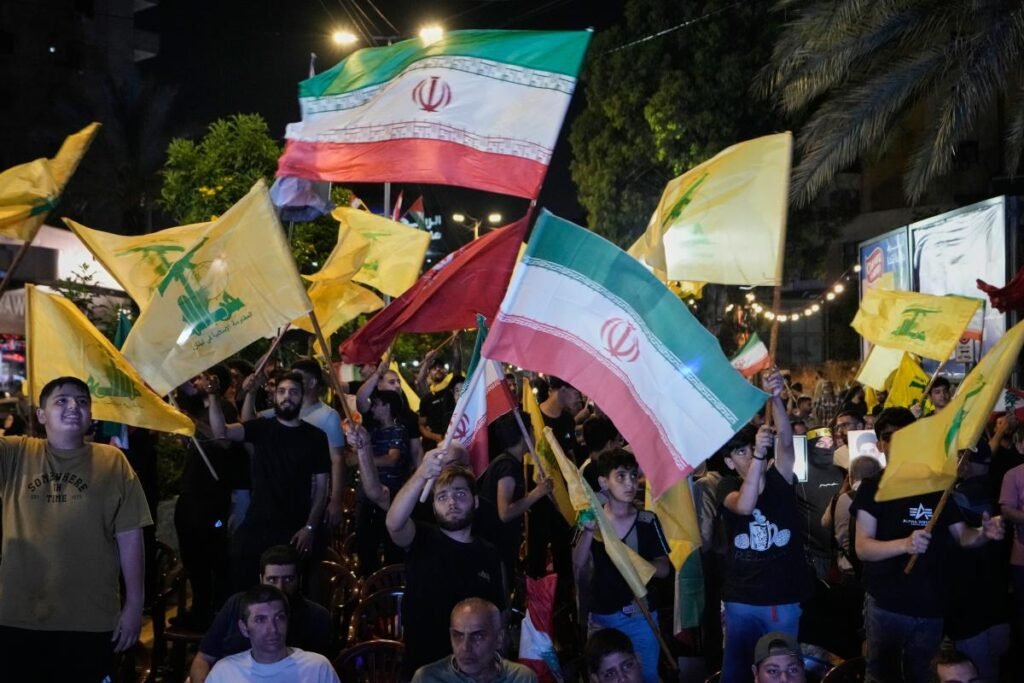 hezbollah-supporters-wave-iranian-national-130497996.jpg