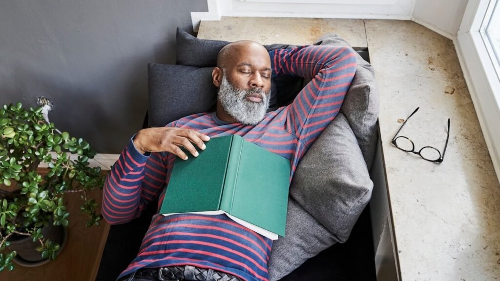 Matur-man-lying-on-bench-with-a-book-taking-a-nap-722237691-Getty.jpg