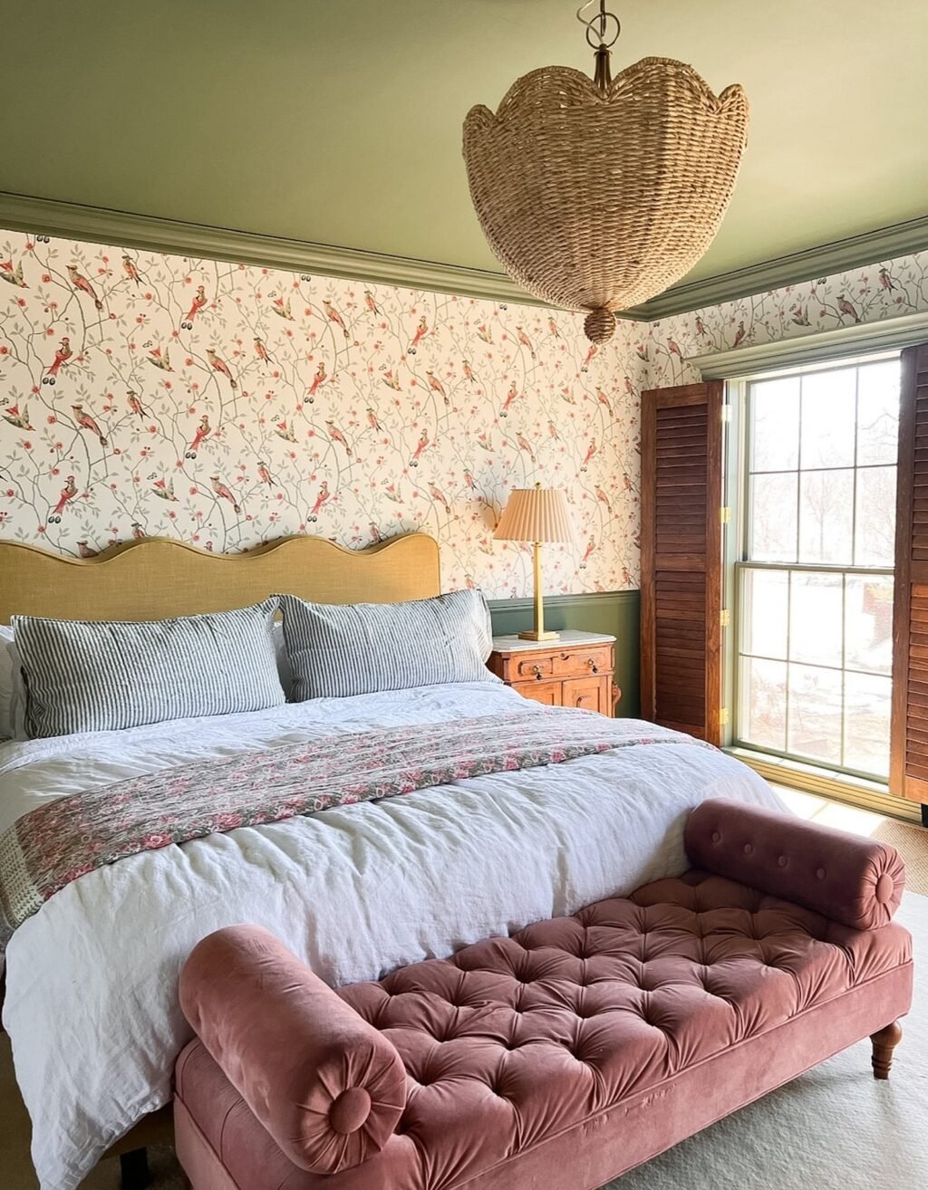 primary-bedroom-with-scalloped-headboard-and-bird-wallpaper.jpeg